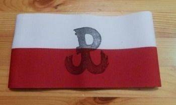 White and red band with the symbol of Fighting Poland